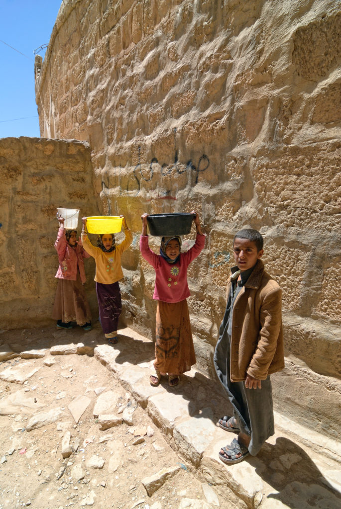 children carry water in Yemen